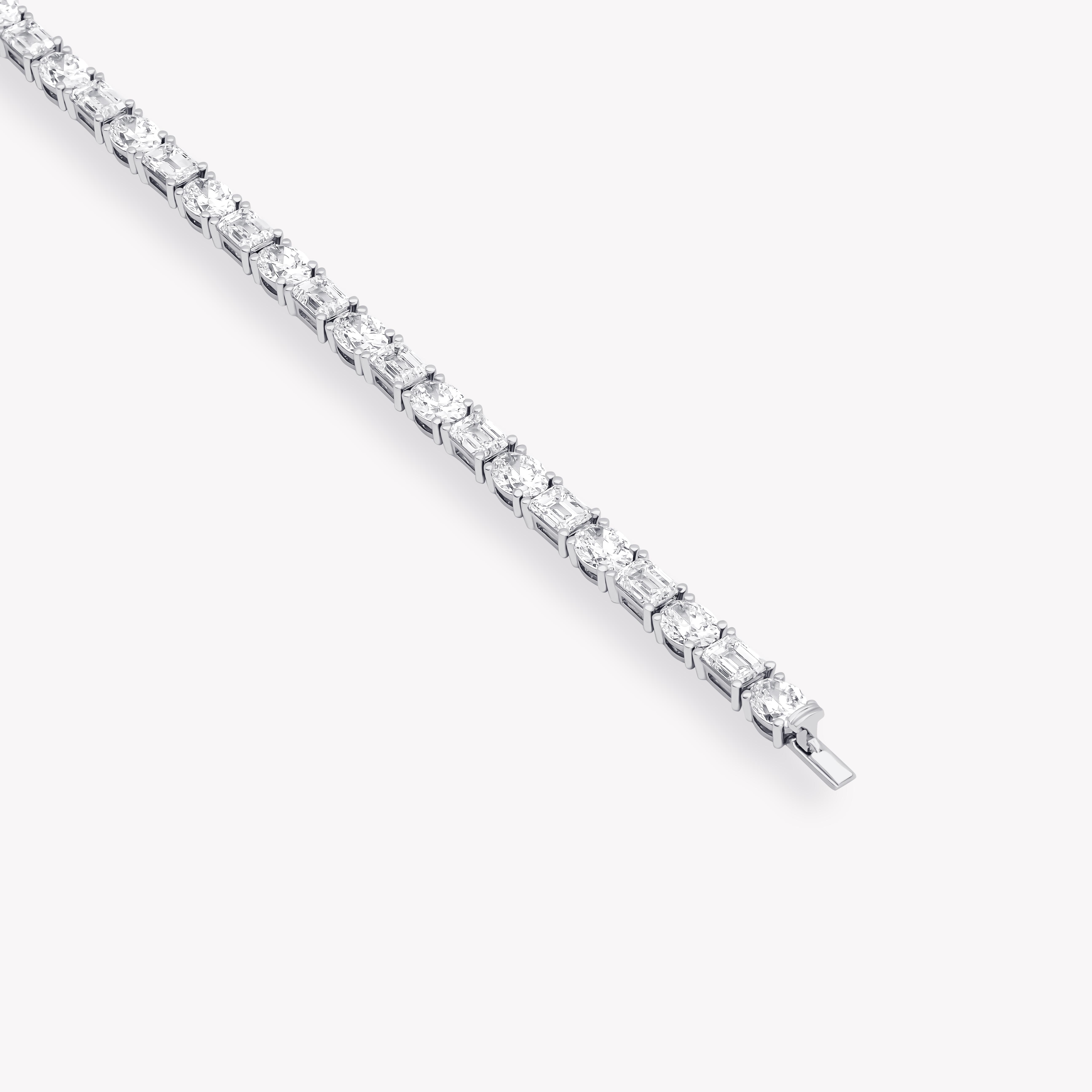 Emerald and oval diamond tennis bracelet