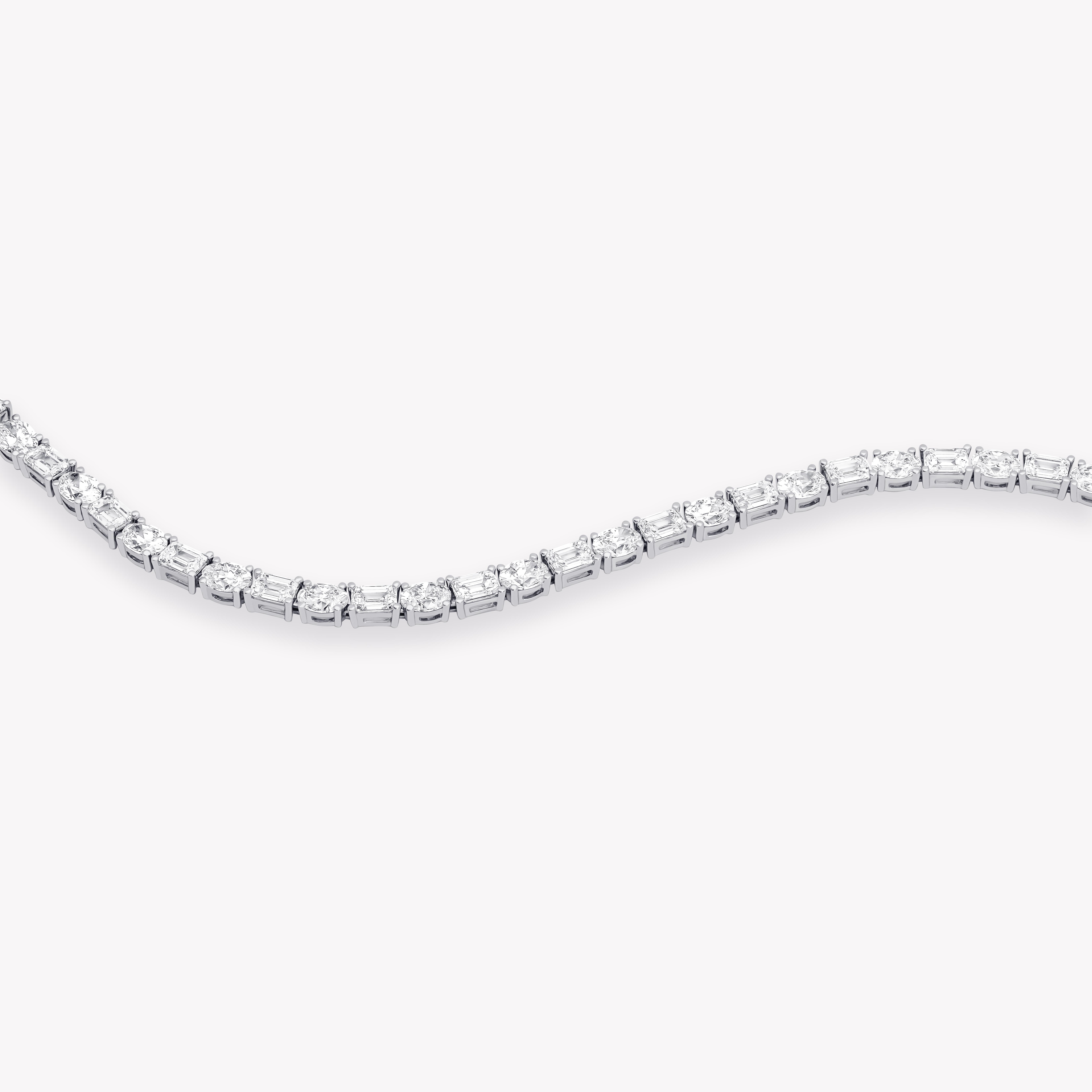 Emerald and oval diamond tennis bracelet