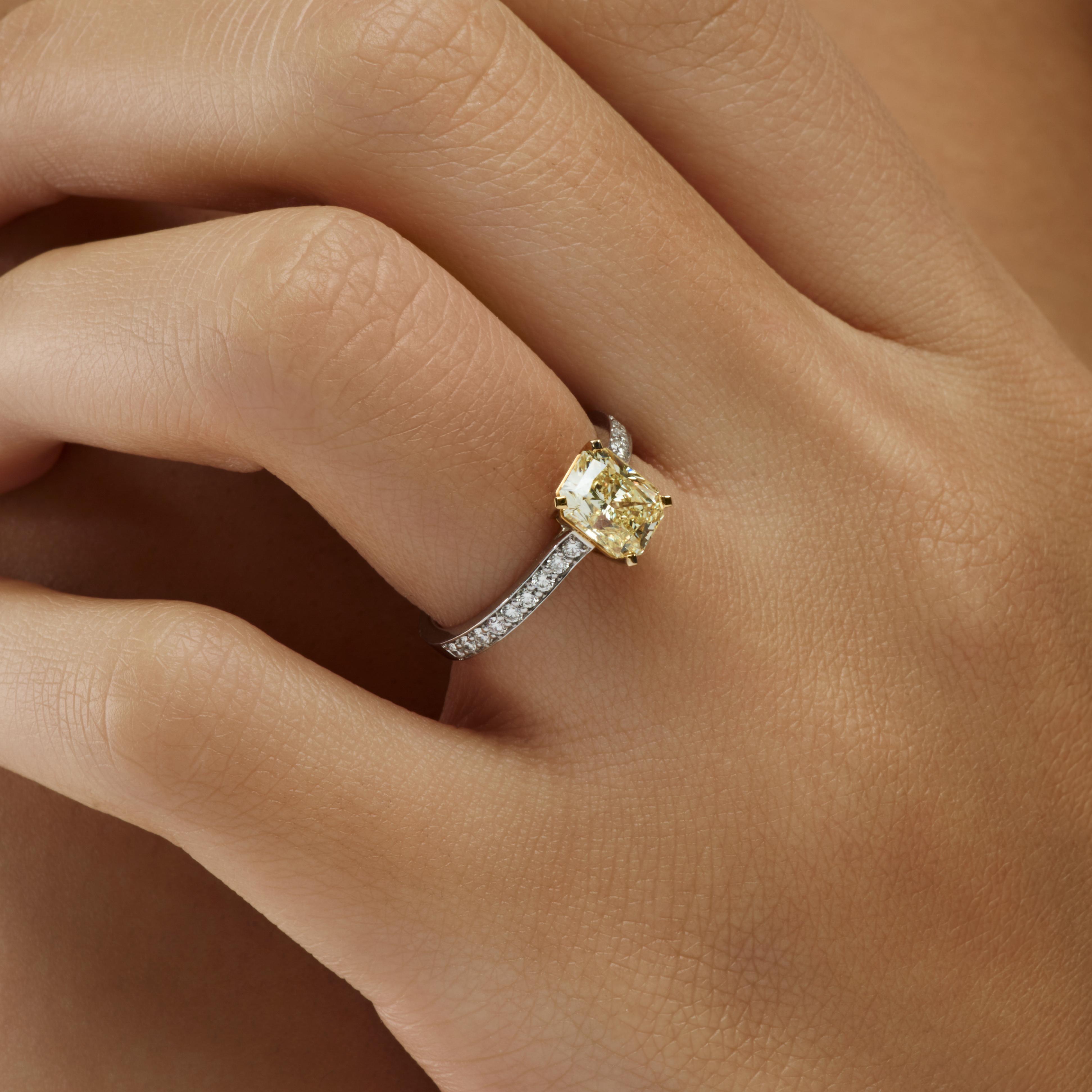 Fancy light yellow radiant diamond ring 